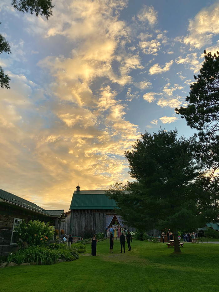Brooklands Farm heritage barn and grounds beneath a Muskoka sunset