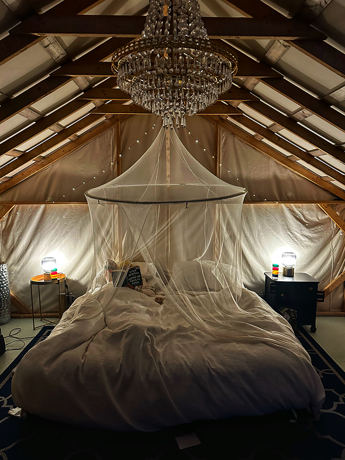 Glamping tent bedroom with chandelier at The Northridge Inn and Resort