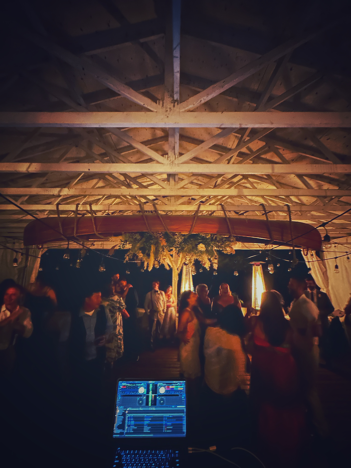 Wedding guests dancing beneath the suspended canoe at The Northridge Inn and Resort