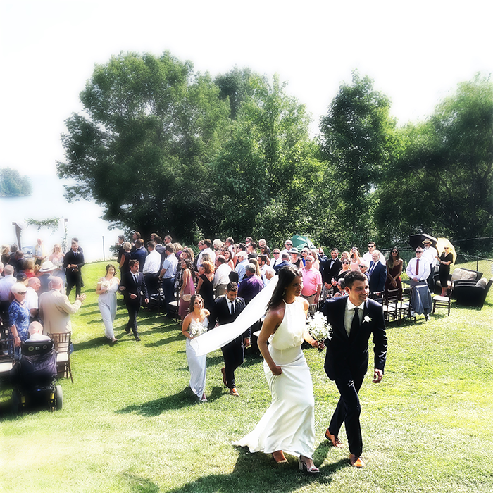 Newly married couple leaving their ceremony at Windermere House